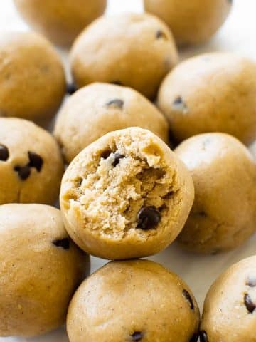 These easy to make cookie dough protein bites are made from just 6 basic ingredients and taste just like cookie dough. Perfect on-the-go or pre-workout snack! Make in bulk to store in the freezer to always have them on hand!