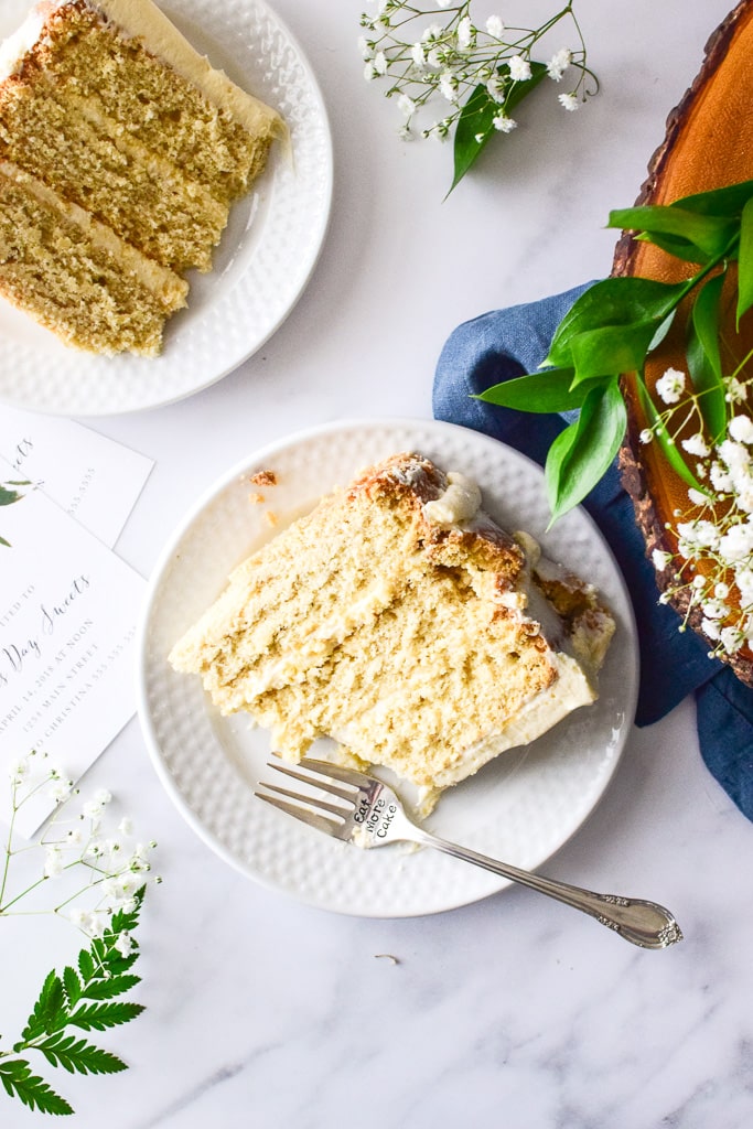 The minimal frosting on the outside exposes the cake layers — perfect for Spring festivities! Find the recipe at runlifteatrepeat.com!