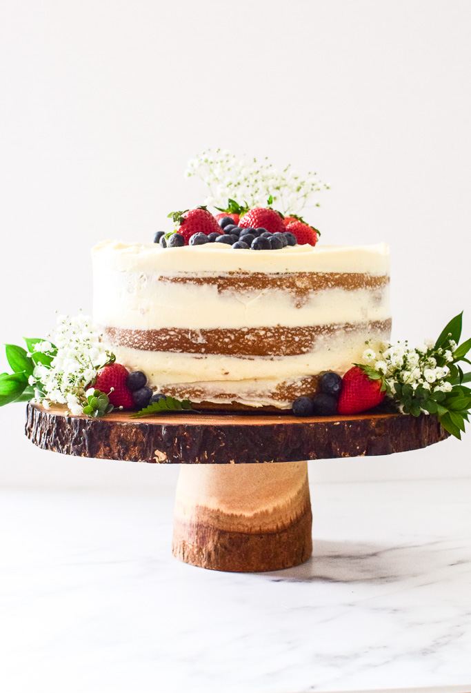 The minimal frosting on the outside exposes the cake layers — perfect for Spring! Find the recipe at runlifteatrepeat.com!