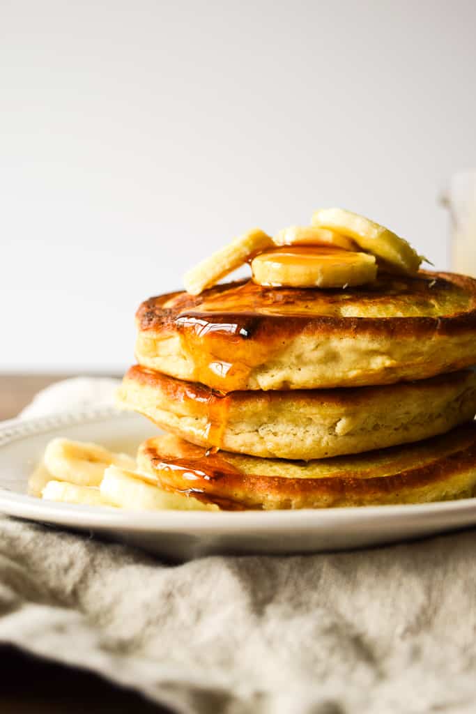 These fluffy and light gluten-free pancakes are super filling and packed with fresh bananas!