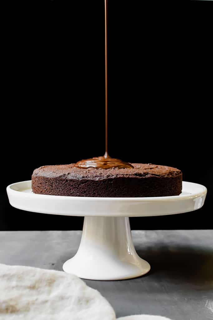 My favorite homemade paleo chocolate cake recipe. It's the richest, the fudgiest and a crowd pleaser! 