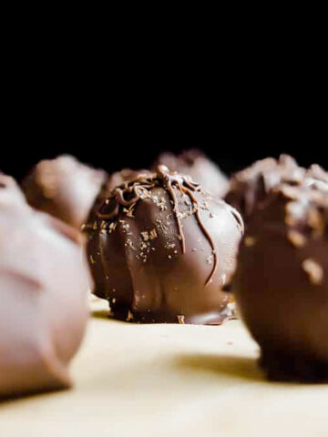 These peanut butter chocolate truffles are unbelievable. Miraculous things happen when peanut butter, dates, and dark chocolate come together!