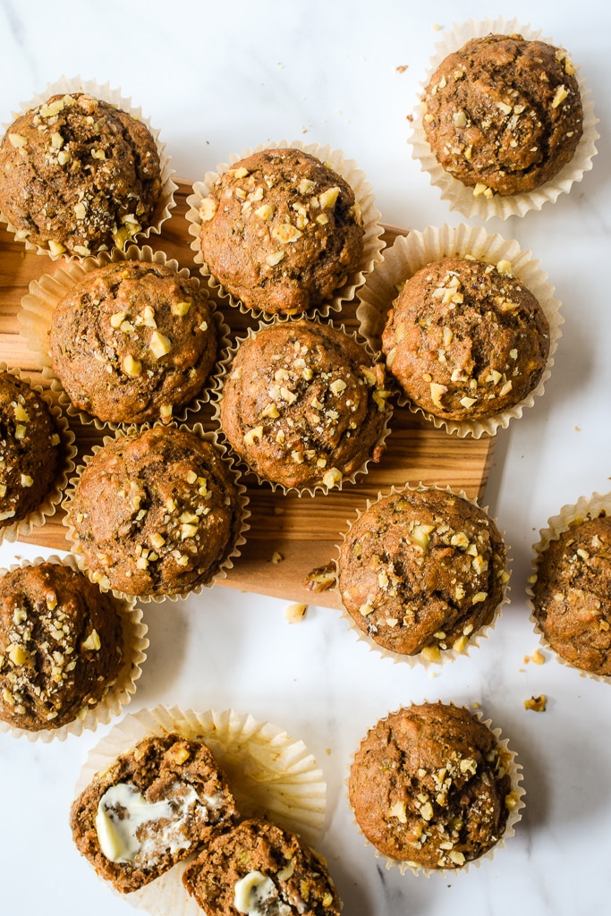 Hearty and satisfying whole wheat muffins filled with bananas and tons of cinnamon! Find the recipe at runlifteatrepeat.com.