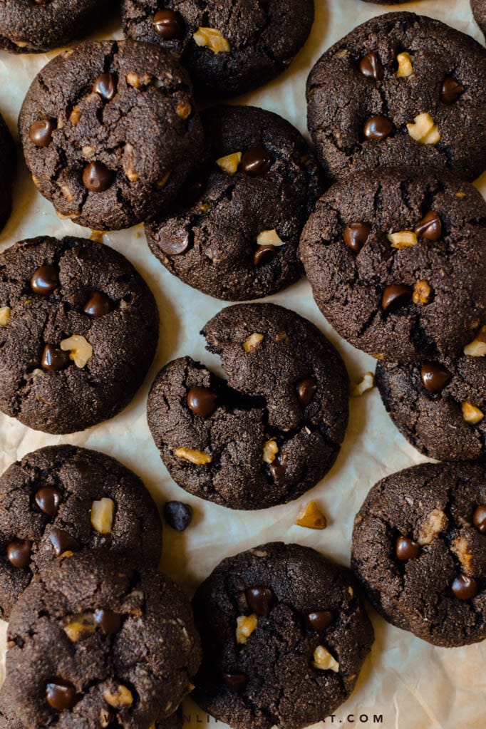 These brownie cookies are fudgy, thick, and chewy with big chunk of chocolate and walnuts studded throughout! Find the recipe at runlifteatrepeat.com.