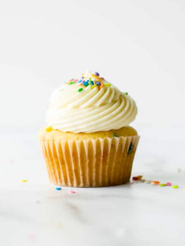 These are the softest and fluffiest vanilla cupcakes studded with rainbow sprinkles. Perfect for a birthday celebration!