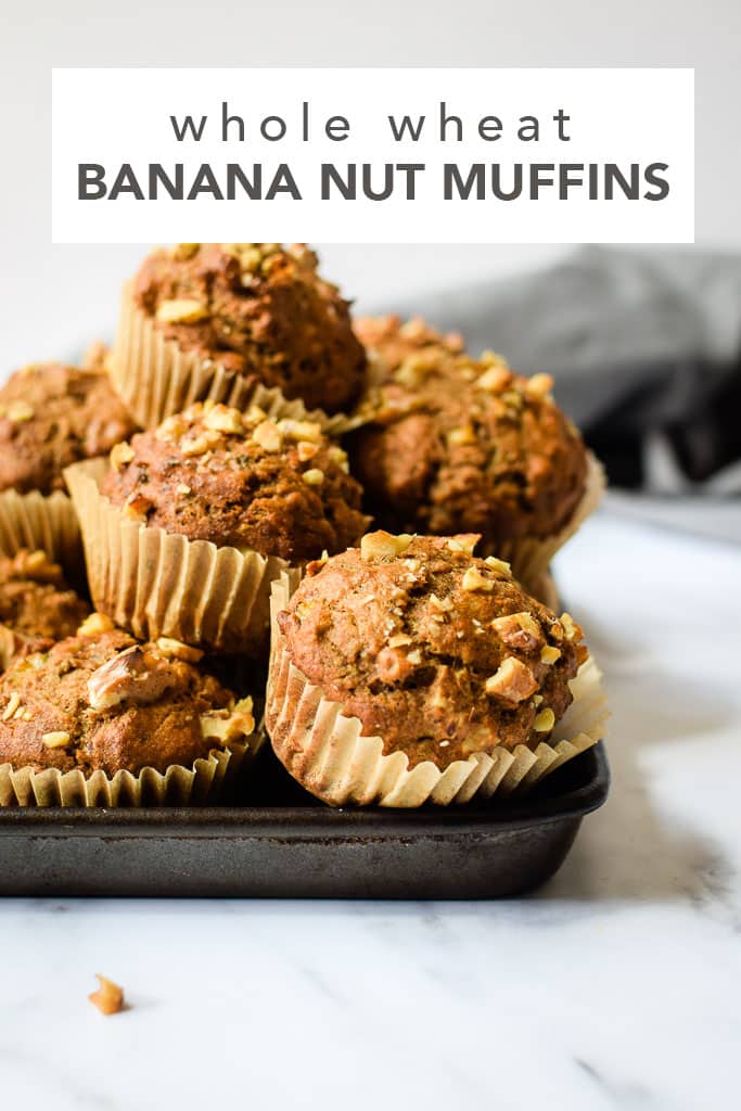 Hearty and satisfying whole wheat muffins filled with bananas and tons of cinnamon! Find the recipe at runlifteatrepeat.com.