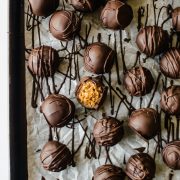 Just one bowl and minimal ingredients to make these no-bake cookie dough truffles. Ready in less than 30 minutes! Recipe on runlifteatrepeat.com. #truffles #paleo #cookiedough #glutenfree #dairyfree #paleorecipes