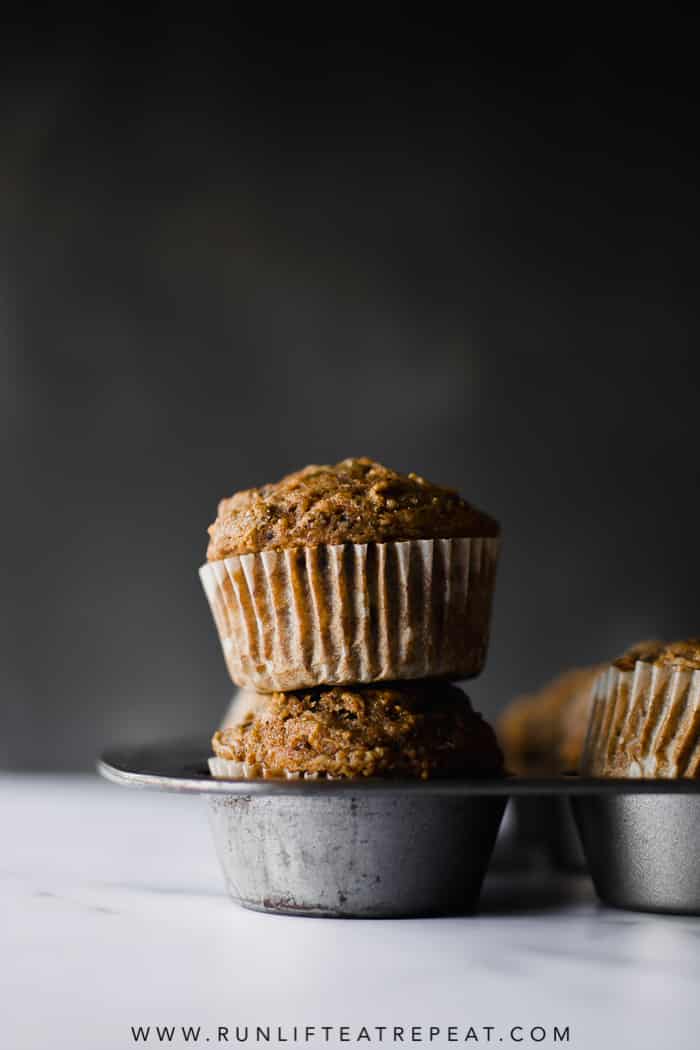 Healthy whole wheat muffins filled with shredded apples, tons of cinnamon spice and zero refined sugar! Find the recipe at runlifteatrepeat.com. #wholewheatmuffins #muffins #breakfast #apple #cinnamon #dairyfree