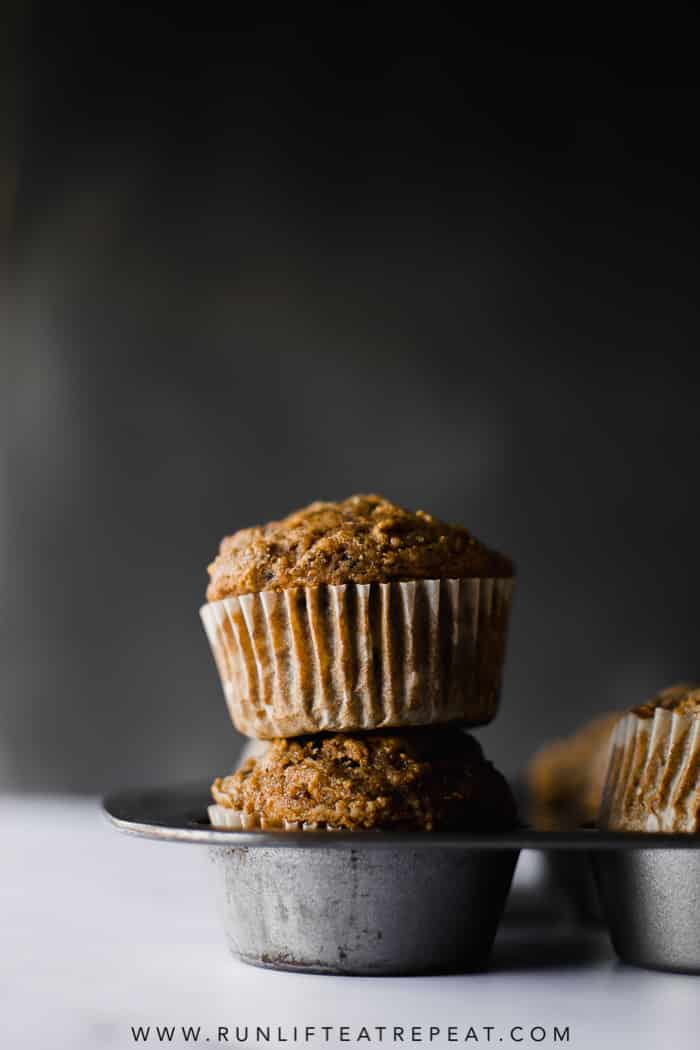 Healthy whole wheat muffins filled with shredded apples, tons of cinnamon spice and zero refined sugar! Find the recipe at runlifteatrepeat.com. #wholewheatmuffins #muffins #breakfast #apple #cinnamon #dairyfree