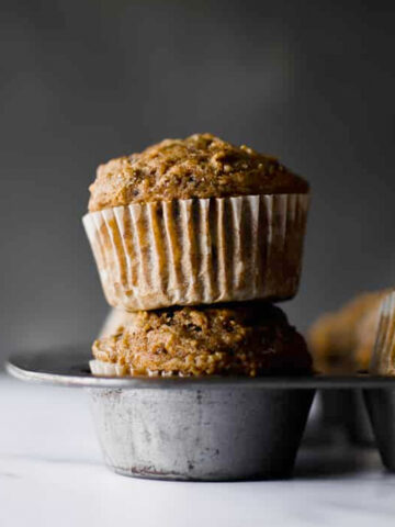 Healthy whole wheat muffins filled with shredded apples, tons of cinnamon spice and zero refined sugar!