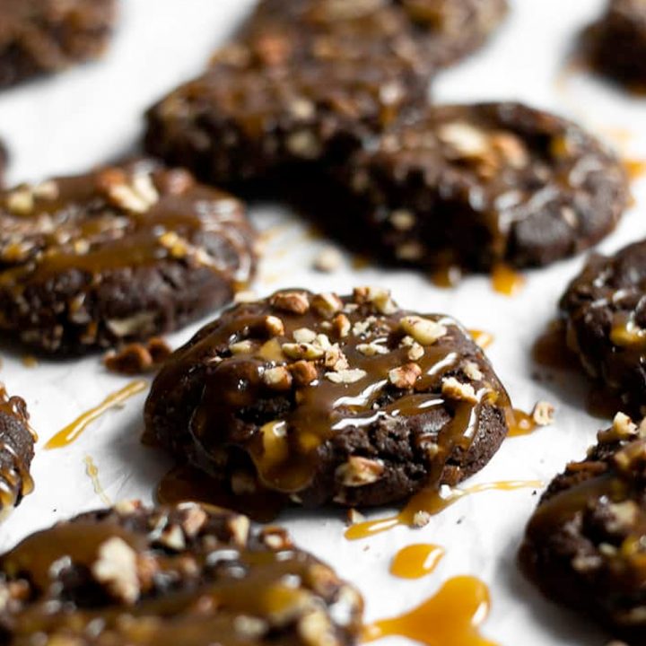 Fudgy brownie-like cookies rolled in pecans and topped with a drizzle of homemade caramel. 