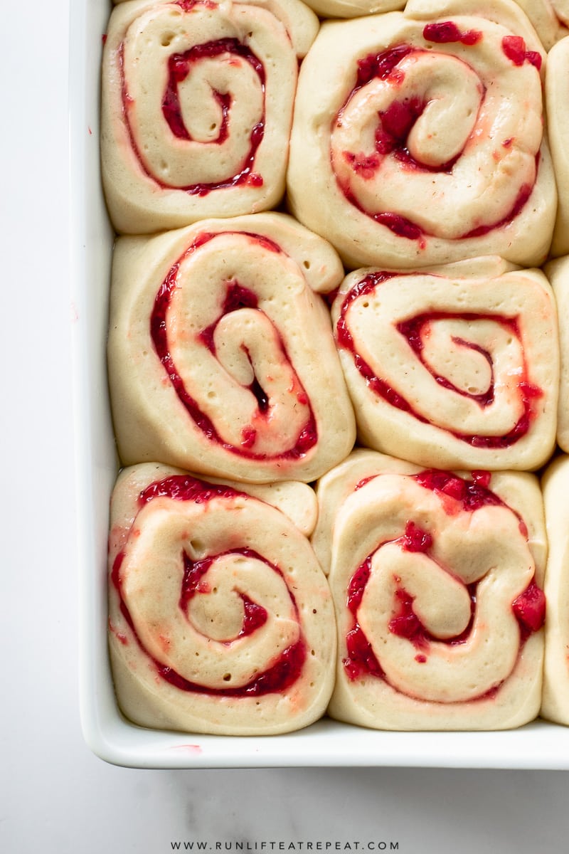 These soft & fluffy homemade strawberry sweet rolls are filled with strawberries and topped with a thick layer of cream cheese icing. Breakfast has never tasted so good!