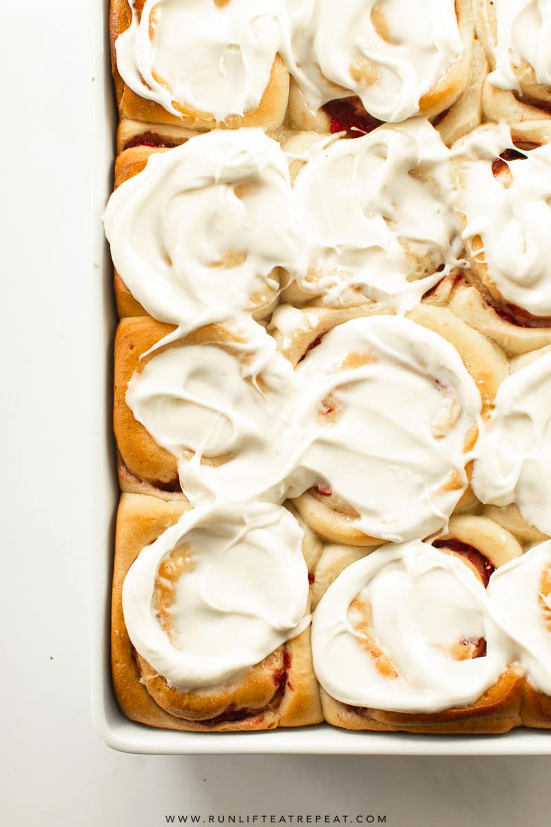 These soft & fluffy homemade strawberry sweet rolls are filled with strawberries and topped with a thick layer of cream cheese icing. Breakfast has never tasted so good!