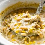 This slow cooker verde chicken chili is homemade, full of flavor, satisfying, and easy to make. Add all the ingredients to the slow cooker and dinner is done when you get home! Get creative with your toppings or use what you have on hand!