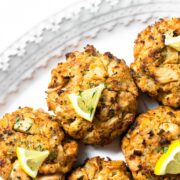 This salmon cake recipe recipe combines the flavors of lemon, parsley, and garlic but the most flavor is from the salmon. For best texture, the recipe has little filler and is baked in a very hot oven.