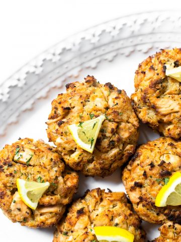 This recipe for salmon cakes combine the flavors of lemon, parsley, and garlic but the most flavor is from the salmon. For best texture, the recipe has little filler and is baked in a very hot oven.