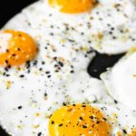 over easy eggs in a skillet
