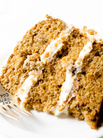 This carrot cake recipe is incredibly moist, bursting with spice flavor, and frosted with a smooth and creamy cream cheese frosting. It's a recipe that you'll be making over and over again.