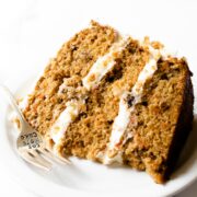 This carrot cake recipe is incredibly moist, bursting with spice flavor, and frosted with a smooth and creamy cream cheese frosting. It's a recipe that you'll be making over and over again.