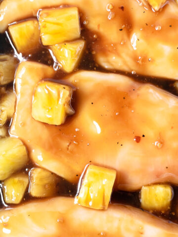This baked pineapple teriyaki chicken is one of the most popular recipes for two reasons— it's a quick and easy dinner recipe and it's lip-smacking delicious! Ready in just 30 minutes, this dinner recipe will appear frequently in your dinner rotation.
