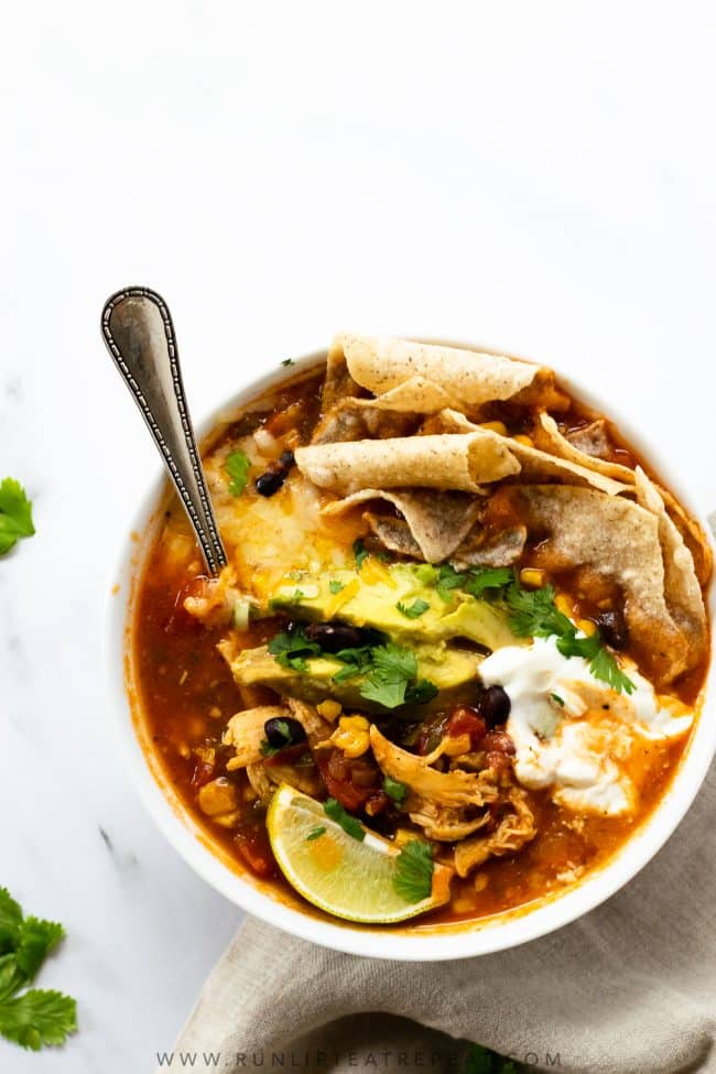This chicken tortilla soup recipe is easy, homemade, and satisfying. The perfect dinner for those cold nights. Add your favorite toppings and adjust the spice level to your liking! It freezes perfectly and keeps for lunches all week.