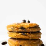These homemade pumpkin chocolate chip pancakes are thick, moist and flavored with those iconic fall spices we all know and love. Start off your fall mornings with a large stack of these pumpkin pancakes.