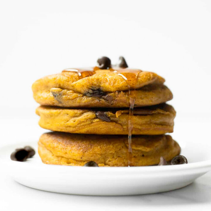 These homemade pumpkin chocolate chip pancakes are thick, moist and flavored with those iconic fall spices we all know and love. Start off your fall mornings with a large stack of these pumpkin pancakes.