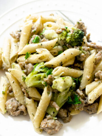 This sausage and broccoli pasta is absolutely delicious. It's not only easy to make, but it's bursting with flavor, feeds a family, and keeps for days in the refrigerator for leftovers!