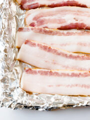 Cooking bacon in the oven creates a perfectly crispy bacon. There's less mess, less to worry about and allows you to multi-task in the kitchen. Follow these simple steps for how to cook bacon in the oven.