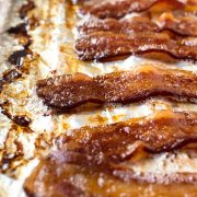 Cooking bacon in the oven creates a perfectly crispy bacon. There's less mess, less to worry about and allows you to multi-task in the kitchen. Follow these simple steps for how to cook bacon in the oven.