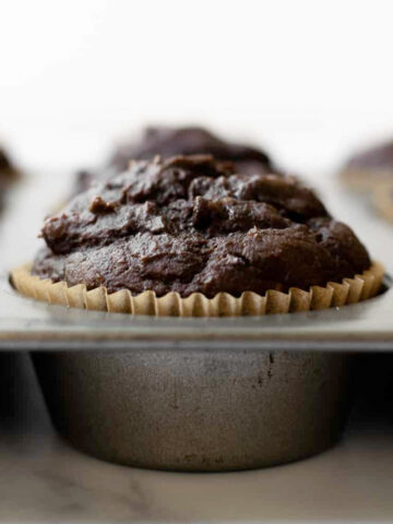 These pumpkin chocolate muffins are made with real pumpkin puree and lots of cozy pumpkin spice. They're full of flavor, incredibly moist, easy to make, and taste even better the next day!