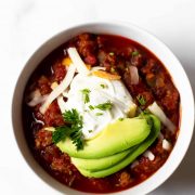 If you want a from scratch traditional chili recipe, look no further. This chili recipe is made with ground turkey (or beef), bell peppers, onion, tomatoes, beans, and a variety of spices. This is a feel-good, hearty, cozy dinner that everyone will love!