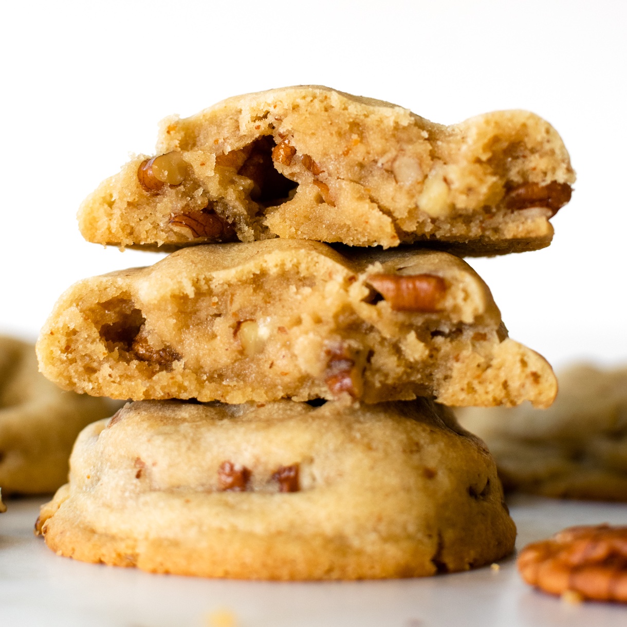 stacked brown butter pecan cookies cut in half