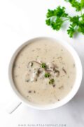 This cream of mushroom soup recipe is easy, homemade, and satisfying. Just a few ingredients paired with tons of mushrooms and this soup will have your mouth watering as it cooks.