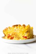 This everything biscuit breakfast casserole combines eggs, peppers, onions, and cheese with buttery biscuits in just one dish! You can use your favorite add-ins too! The best part is that you can prepare it ahead of time for busy mornings!