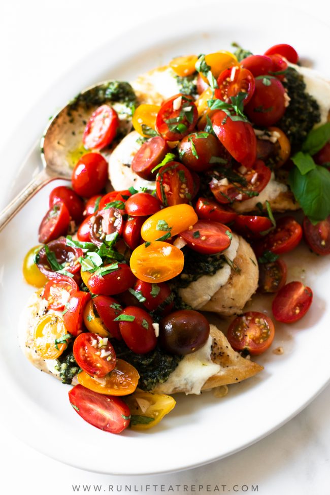 This pesto bruschetta chicken is made with simple feel-good ingredients and is on the table in 35 minutes! This recipe has layers of flavors from the pesto, to the bruschetta, to the chicken. It's a rave-worthy recipe that will be on repeat no matter the time of year!