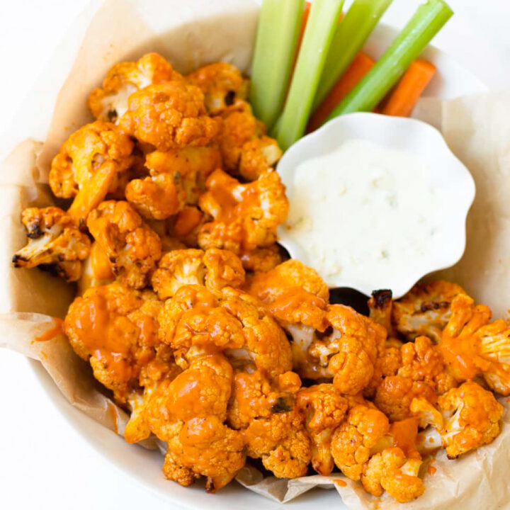 This buffalo cauliflower can be baked or made in the air fryer. This recipe is easy to make and delivers all of the same flavor of buffalo wings but in a lighter way! This buffalo cauliflower recipe will be the star of all other appetizers.