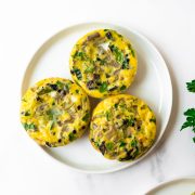 These egg muffins are an easy breakfast idea that you can make ahead for the week. With many names, including egg eggs or egg bites, they are all made with a combination of eggs, vegetables, cheese and can include meat. They are baked in a muffin pan and done in just 20 minutes!