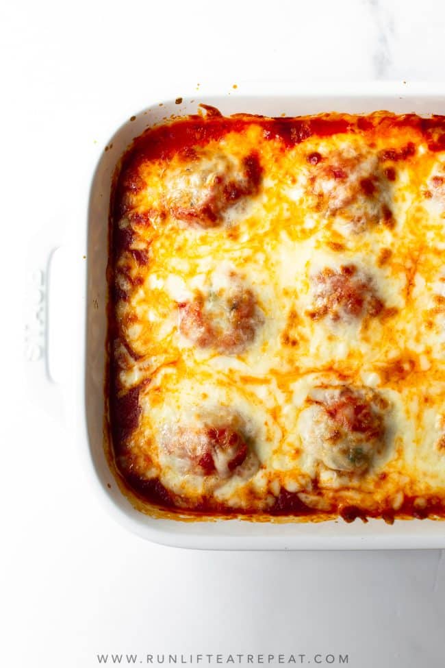 This recipe for oven baked meatballs is an easy weeknight dinner. The meatballs are made with ground turkey, a combination of spices and a few other basic ingredients. The meatballs are baked in the oven until tender and topped with shredded mozzarella cheese.