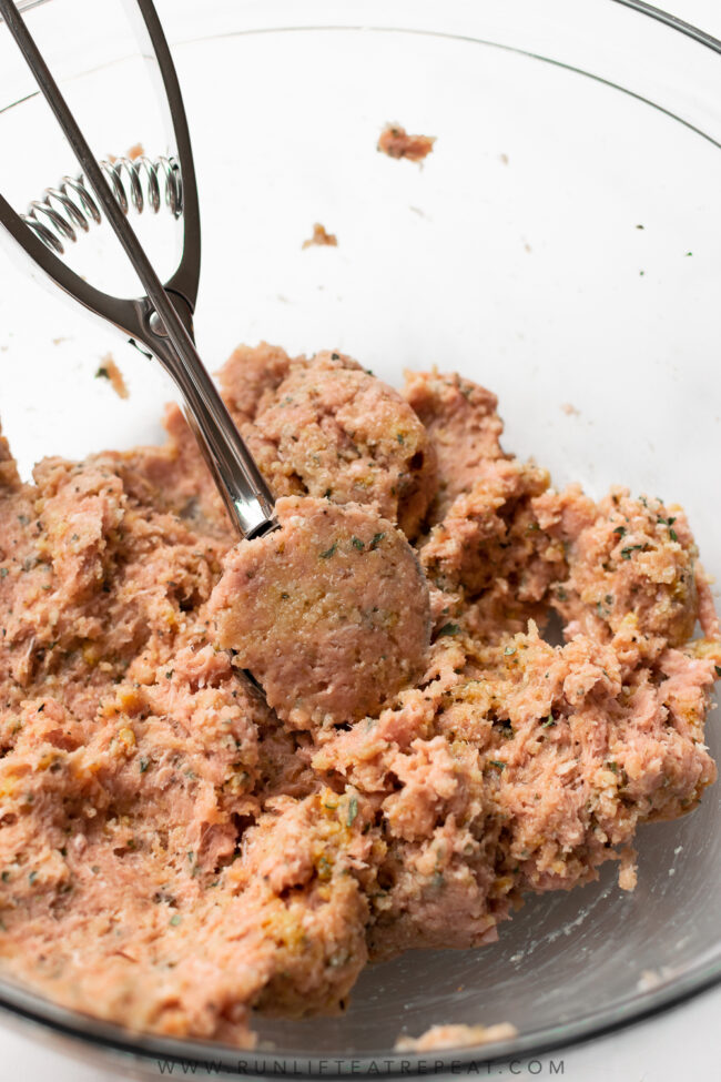 This recipe for oven baked meatballs is an easy weeknight dinner. The meatballs are made with ground turkey, a combination of spices and a few other basic ingredients. The meatballs are baked in the oven until tender and topped with shredded mozzarella cheese.