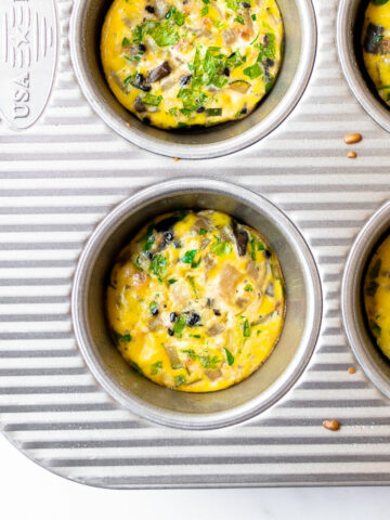 These egg muffins are an easy breakfast idea that you can make ahead for the week. With many names, including breakfast cups, egg cups or egg bites, they are all made with a combination of eggs, vegetables, cheese and can include meat. They are baked in a muffin pan and done in just 20 minutes!