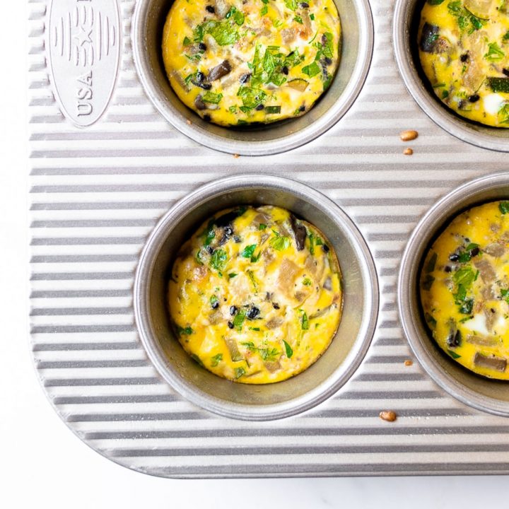 These egg muffins are an easy breakfast idea that you can make ahead for the week. With many names, including breakfast cups, egg cups or egg bites, they are all made with a combination of eggs, vegetables, cheese and can include meat. They are baked in a muffin pan and done in just 20 minutes!
