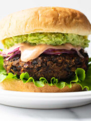 If you're craving big flavor in a burger, you need to make these black bean burgers. With 5 star reviews from taste testers, I'm certain that you'll love this black bean burger recipe just as much as I do!
