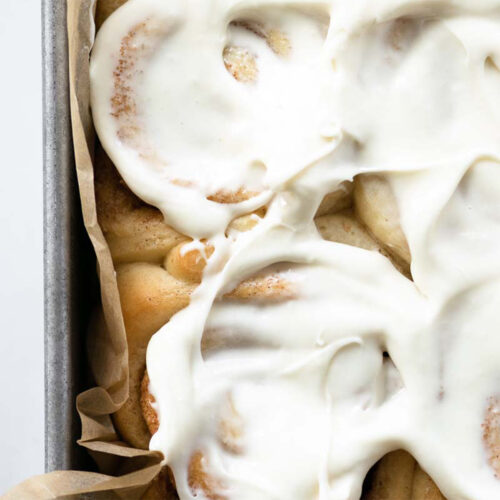 These homemade cinnamon rolls are soft and fluffy, filled with the most delicious cinnamon sugar swirl, have warm and gooey centers, slightly golden brown edges, and smothered in a generous amount of cream cheese frosting. Nothing beats this classic recipe!