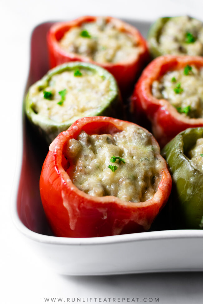 I'm singing all the songs for this sausage stuffed peppers recipe because it's THE dinner recipe to make this week. Featuring a flavorful filling that's made with ground sausage, onions, mushrooms, garlic, herbs, chicken broth, and quinoa. It's a hearty dinner recipe that the whole family will love!
