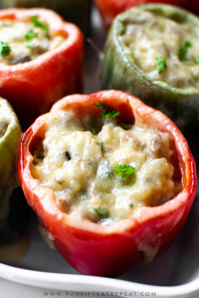 I'm singing all the songs for this sausage stuffed peppers recipe because it's THE dinner recipe to make this week. Featuring a flavorful filling that's made with ground sausage, onions, mushrooms, garlic, herbs, chicken broth, and quinoa. It's a hearty dinner recipe that the whole family will love!