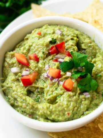 This outrageously flavorful and easy guacamole recipe comes together in just minutes. Made with classic ingredients like avocados, lime juice, red onion, cilantro, jalapeño and spices— it's a recipe that you'll make over and over again!