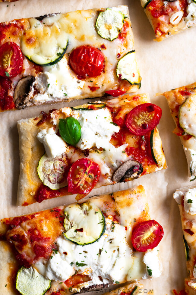 This zucchini, mushroom & tomato herbed ricotta flatbread pizza uses my favorite flatbread dough recipe. It's topped with herbed garlic ricotta cheese, zucchini, tomatoes, and a little fresh basil to finish it off. It's a dinner recipe that the entire family loves!