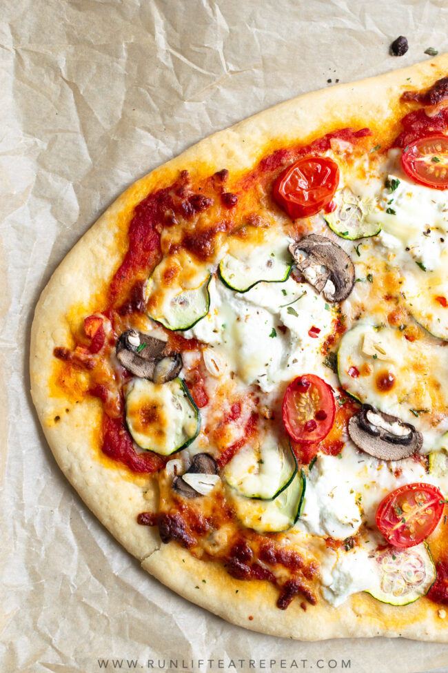 This zucchini, mushroom & tomato herbed ricotta flatbread pizza uses my favorite flatbread dough recipe. It's topped with herbed garlic ricotta cheese, zucchini, tomatoes, and a little fresh basil to finish it off. It's a dinner recipe that the entire family loves!