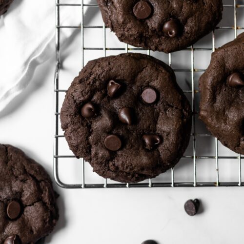 These double chocolate chip cookies are rich and fudgy, incredibly super soft and brownie-like centers, chewy edges, and chocolate chips studded throughout. Easy to throw together, no dough chilling, and just 10 minutes to bake!